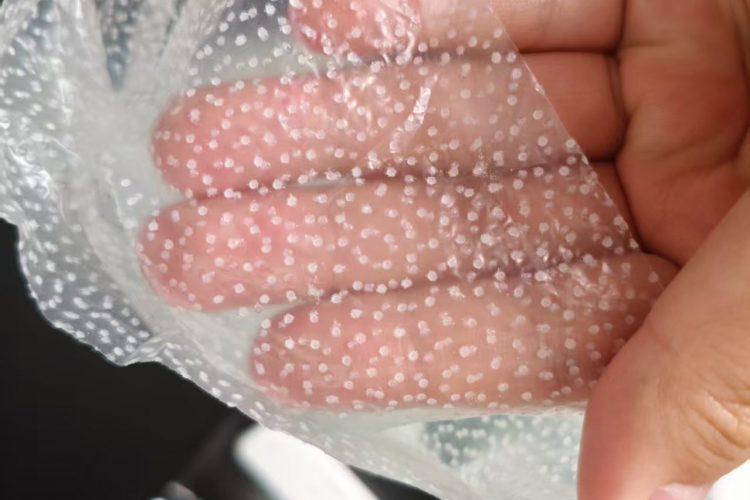 Glove-shaped double-sided TPU waterproof membrane details with hot melt adhesive points 2 Glove-shaped double-sided TPU waterproof membrane details with hot melt adhesive points 2