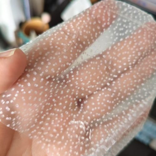 Details of the glove-shaped double-sided PU waterproof membrane with hot melt adhesive dots