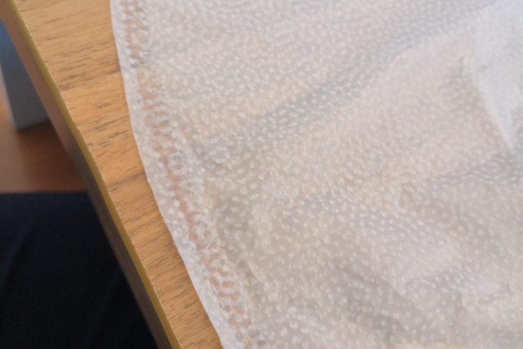 Detail of sock-shaped PU waterproof membrane with hot melt adhesive dots on both sides Detail of sock-shaped PU waterproof membrane with hot melt adhesive dots on both sides