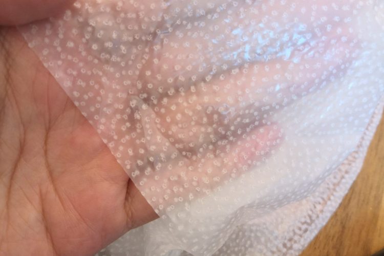 Sock-shaped double-sided PU waterproof membrane with hot melt adhesive dots details 2 Sock-shaped double-sided PU waterproof membrane with hot melt adhesive dots details 2