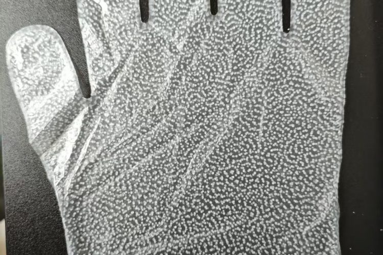 Glove-shaped double-sided PU waterproof membrane with hot melt adhesive dots Glove-shaped double-sided PU waterproof membrane with hot melt adhesive dots